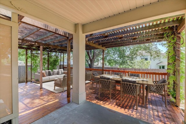 view of patio featuring a pergola, outdoor lounge area, and a wooden deck