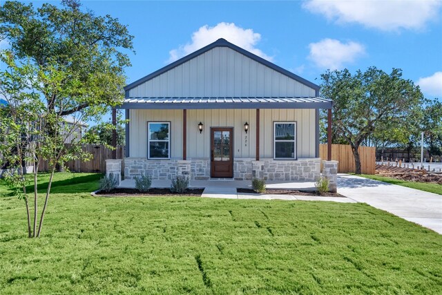 view of front of property with a porch and a front yard