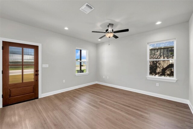 foyer featuring ceiling fan and hardwood / wood-style flooring