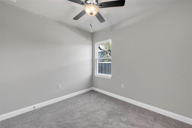 empty room featuring carpet and ceiling fan