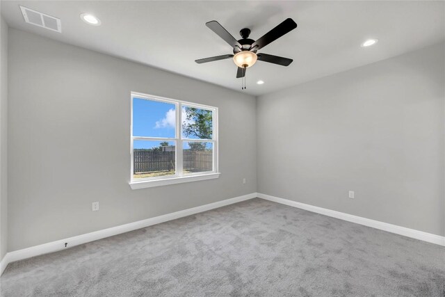 carpeted empty room with ceiling fan