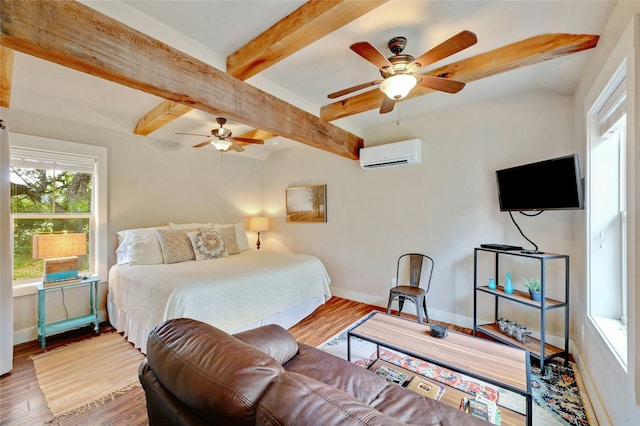 bedroom with an AC wall unit, ceiling fan, wood-type flooring, and beamed ceiling