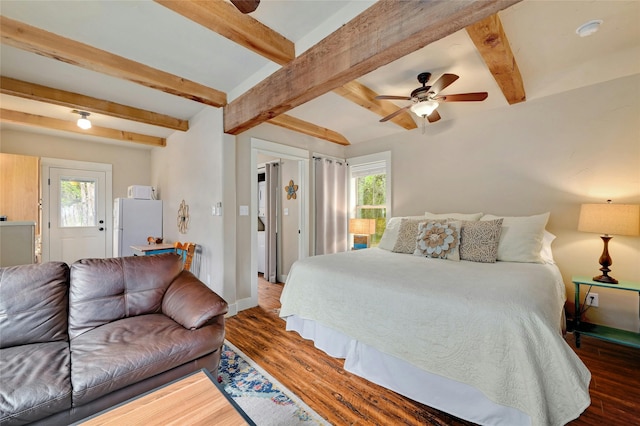 bedroom with ceiling fan, multiple windows, dark hardwood / wood-style flooring, and white fridge