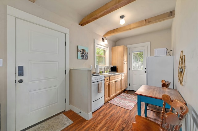 kitchen featuring dark wood-type flooring, white appliances, light brown cabinets, and beam ceiling