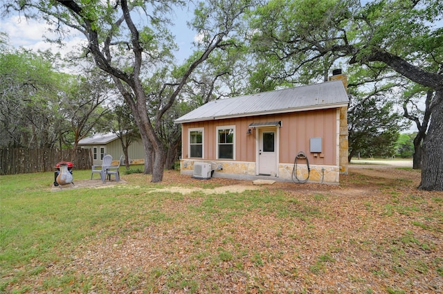 exterior space with an outbuilding and a yard