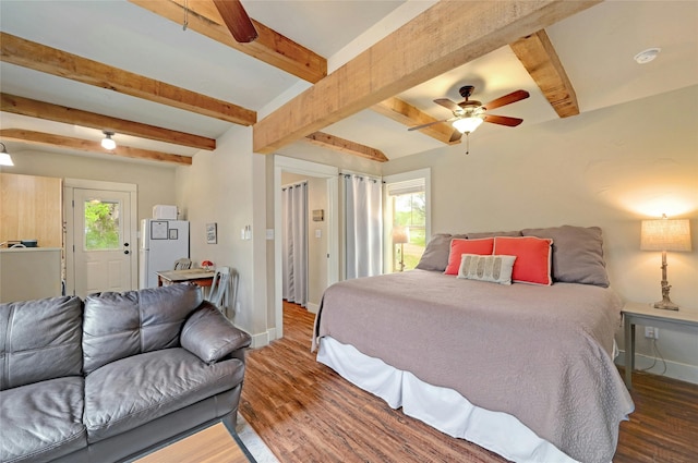 bedroom with ceiling fan, beam ceiling, dark hardwood / wood-style floors, and white fridge