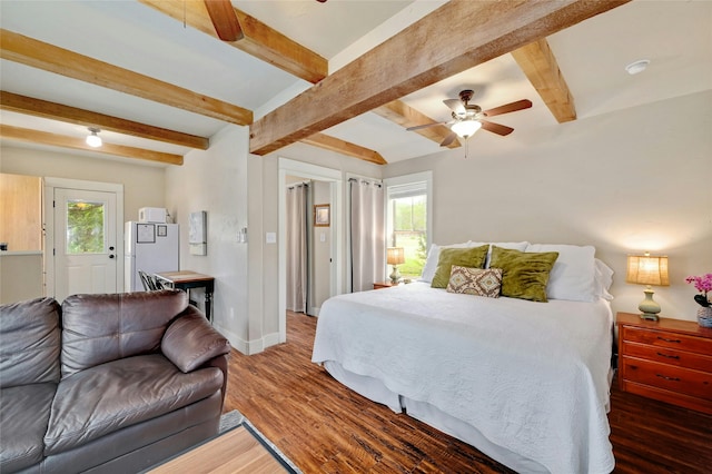 bedroom featuring ceiling fan, dark hardwood / wood-style flooring, beamed ceiling, and white fridge