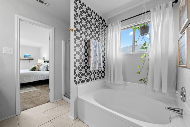 bathroom featuring plus walk in shower and tile patterned floors