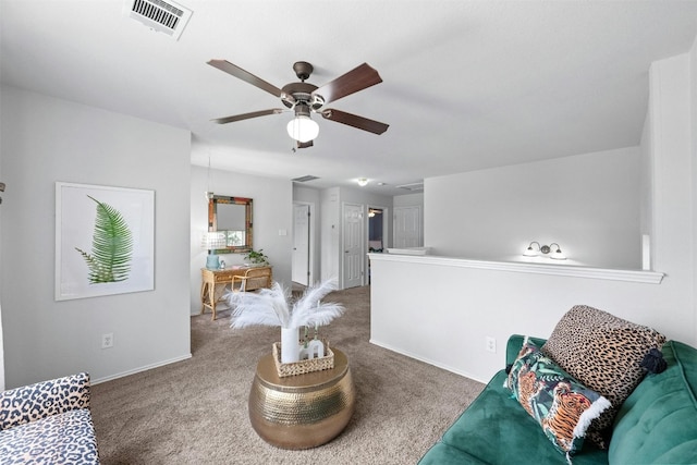 carpeted living room with ceiling fan