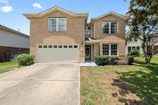 front facade featuring a garage and a front lawn