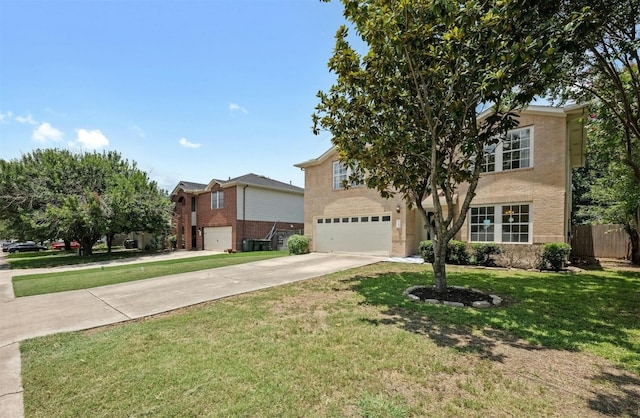 view of front facade with a front yard and a garage