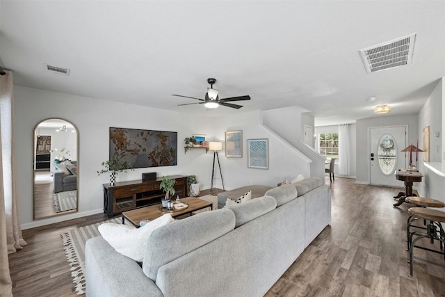 living room featuring ceiling fan and wood-type flooring