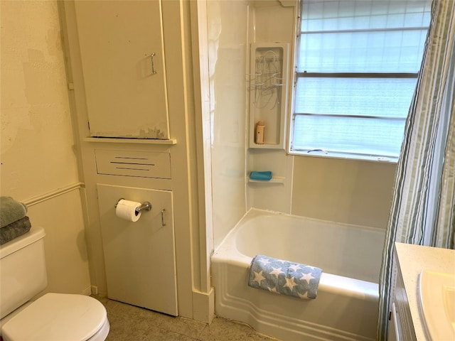 full bathroom featuring vanity, shower / bath combo, and toilet