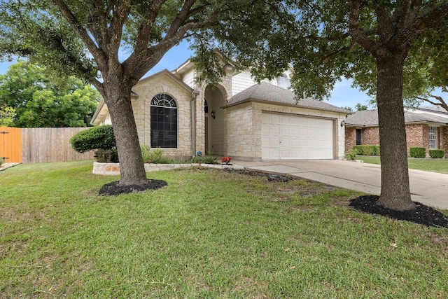 view of front of home featuring a front lawn and a garage