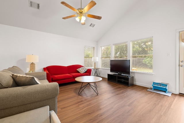 living room with ceiling fan, high vaulted ceiling, and hardwood / wood-style flooring