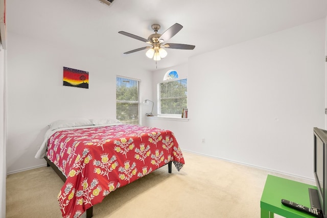 bedroom with ceiling fan and carpet floors