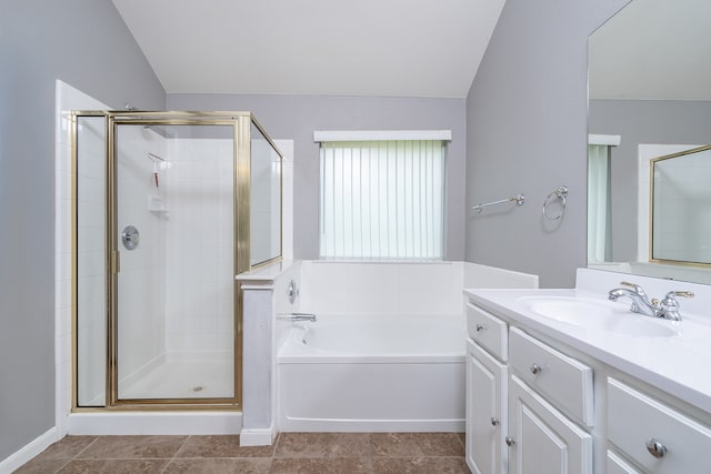 bathroom featuring vanity, separate shower and tub, and vaulted ceiling