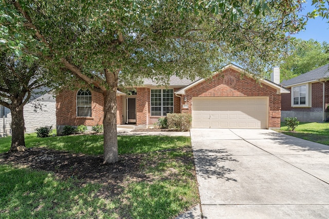 ranch-style house featuring a front lawn and a garage