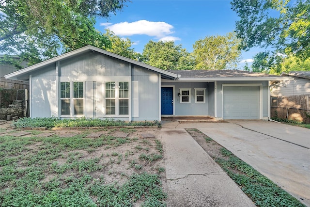 single story home featuring a garage