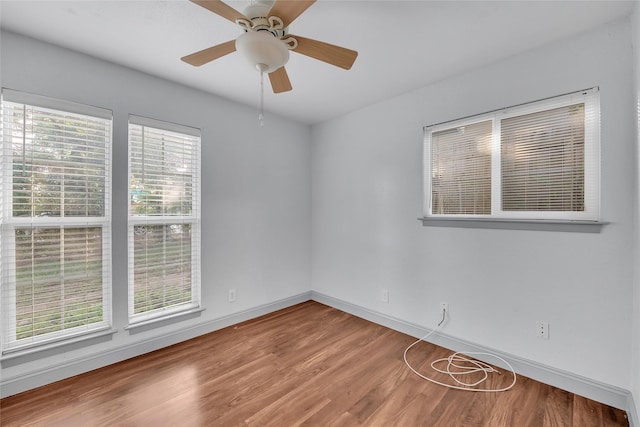 unfurnished room with ceiling fan and hardwood / wood-style floors