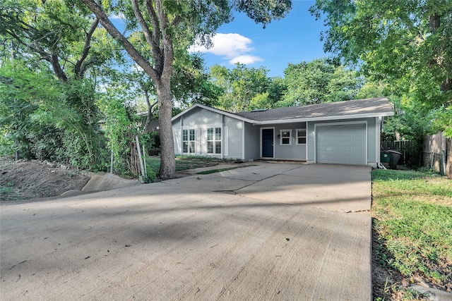 ranch-style home with a garage