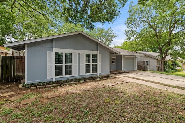 3411 Thomas Kincheon St, Austin, TX 78745 - ranch-style house with an attached garage and driveway