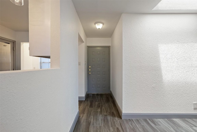 3411 Thomas Kincheon St, Austin, TX 78745 - hallway featuring a textured wall and dark wood finished floors