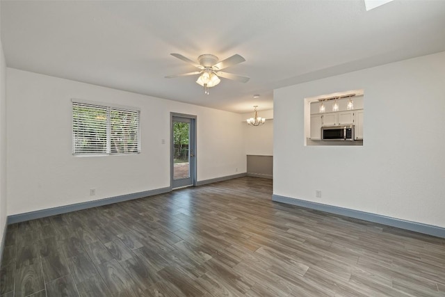 3411 Thomas Kincheon St, Austin, TX 78745 - spare room featuring a chandelier, wood finished floors, and a ceiling fan