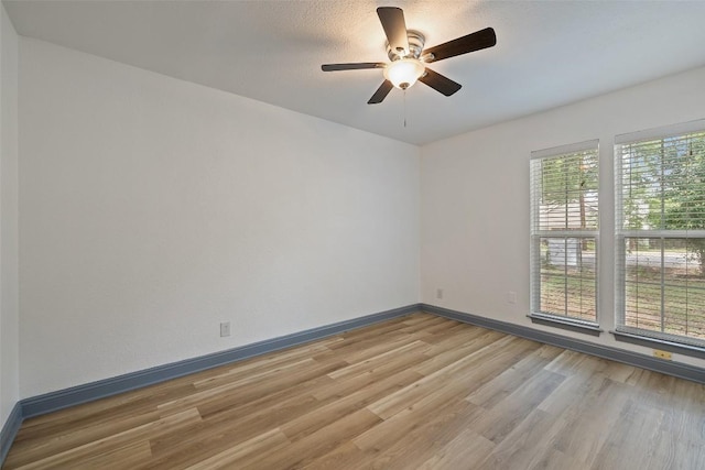 3411 Thomas Kincheon St, Austin, TX 78745 - empty room with light wood finished floors and ceiling fan