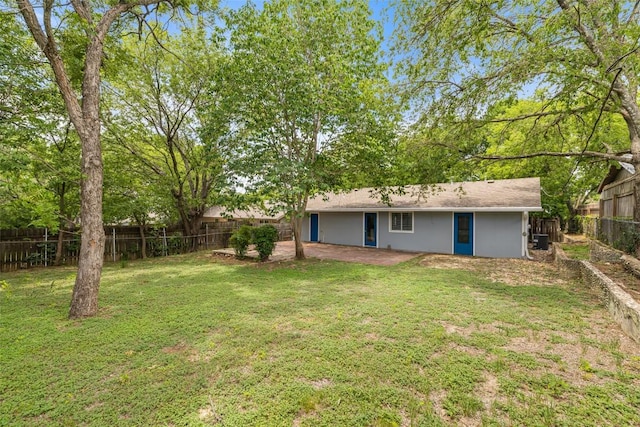 3411 Thomas Kincheon St, Austin, TX 78745 - fenced backyard featuring a patio area