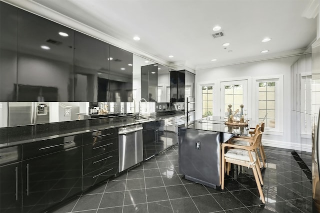 kitchen featuring crown molding, sink, and stainless steel dishwasher