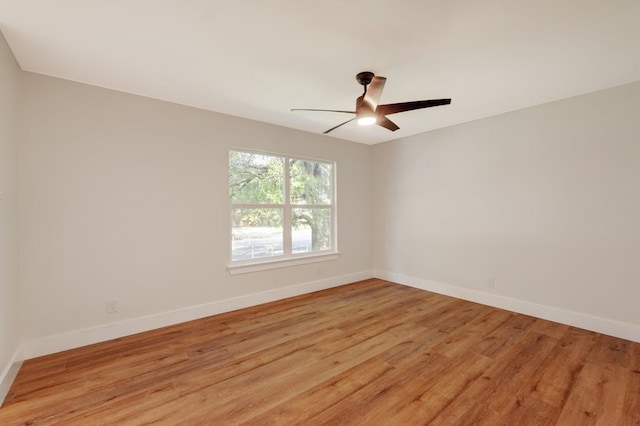 unfurnished room featuring light wood-type flooring and ceiling fan