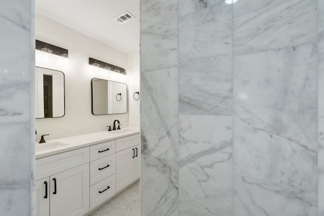 bathroom featuring dual vanity