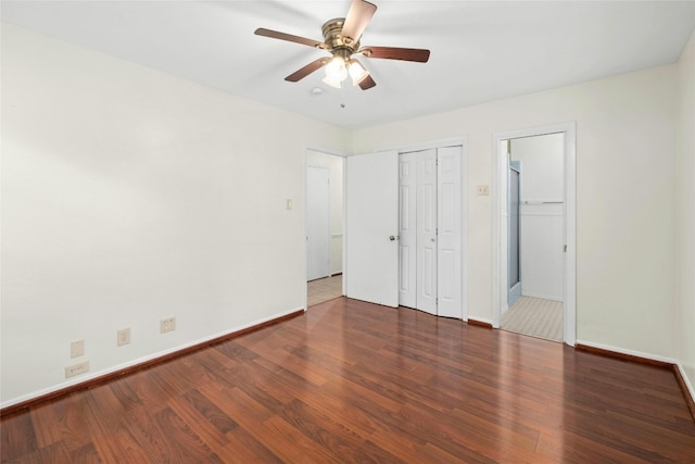 unfurnished bedroom featuring ceiling fan, baseboards, and wood finished floors