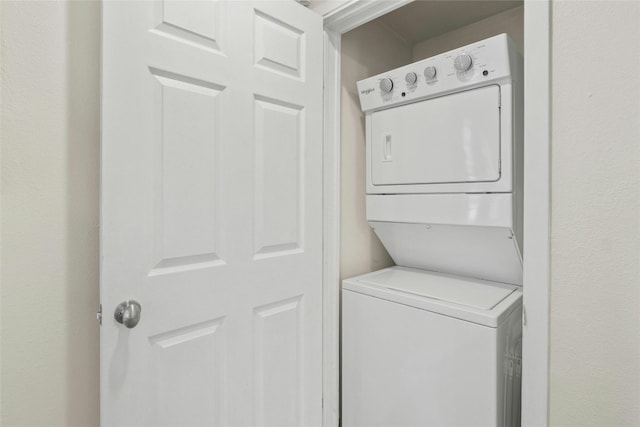 laundry room featuring stacked washing maching and dryer and laundry area