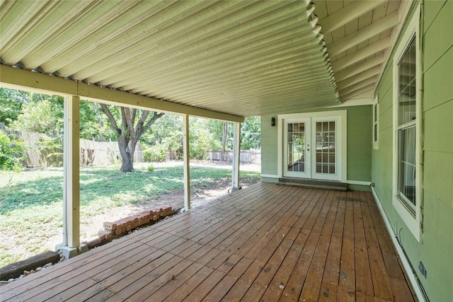 wooden terrace featuring french doors and fence