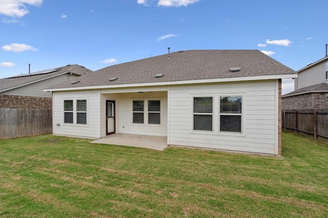 back of property featuring a patio and a lawn