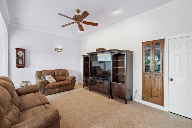 living area featuring baseboards, carpet floors, ceiling fan, and crown molding