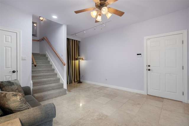 living room featuring ceiling fan, light tile patterned flooring, and rail lighting