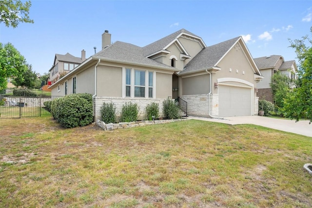 view of front of property with a front yard and a garage