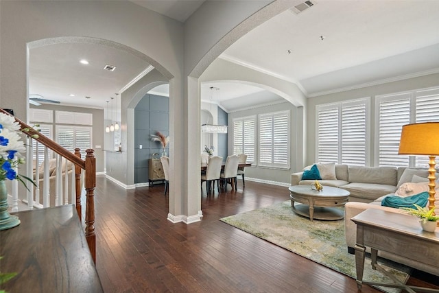 living room featuring dark hardwood / wood-style floors and ornamental molding