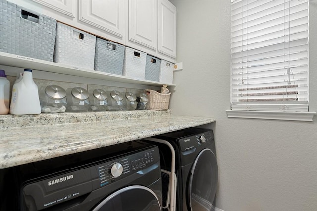 laundry room with cabinets and independent washer and dryer