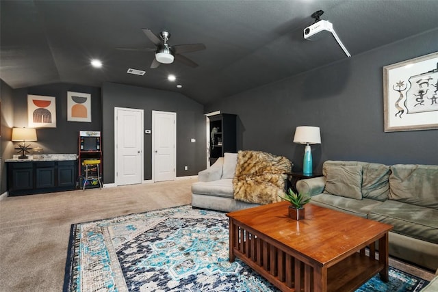 living room with carpet flooring, vaulted ceiling, and ceiling fan