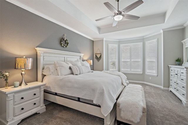 bedroom with carpet, a raised ceiling, and ceiling fan