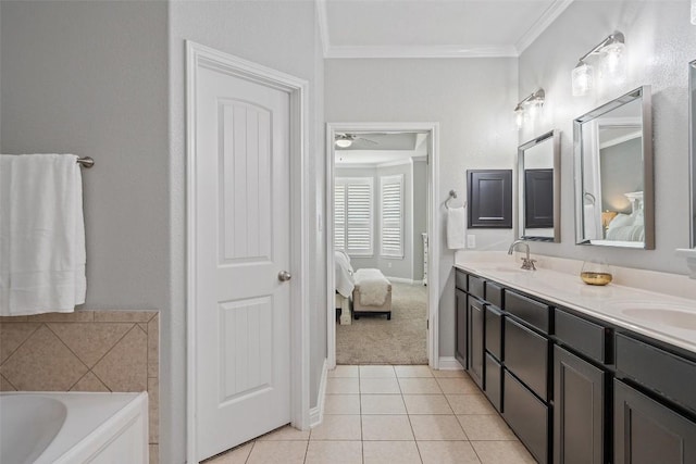 bathroom with a tub, ceiling fan, tile patterned floors, crown molding, and vanity