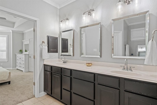 bathroom featuring tile patterned flooring, vanity, and ornamental molding