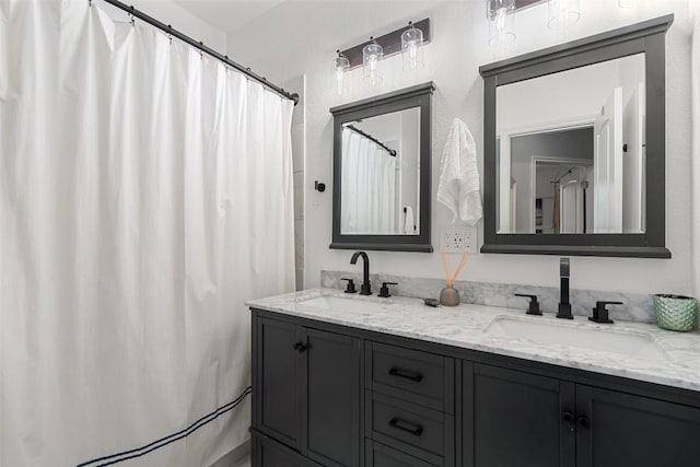 bathroom featuring a shower with curtain and vanity