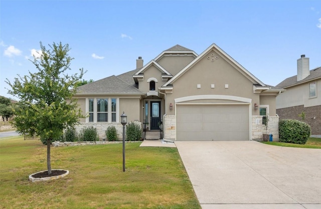 view of front of home featuring a front lawn and a garage