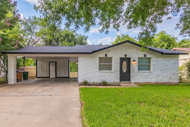 ranch-style house with a carport and a front lawn