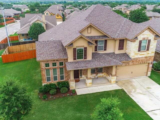 view of front of house with a patio and a front yard